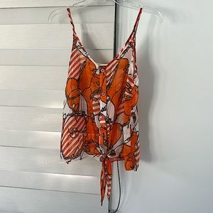 Top, with thin straps, bottom down and tie knot in front.